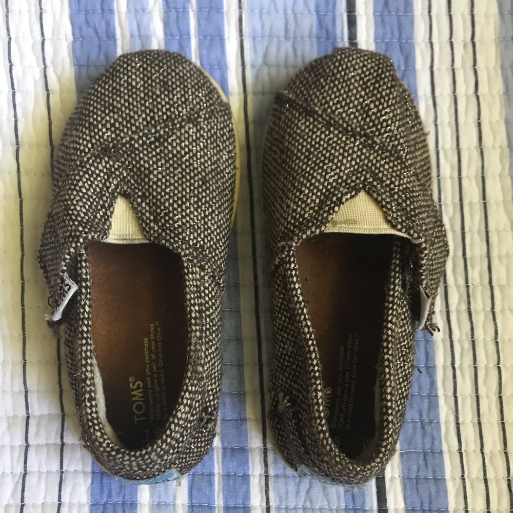 TOMS. Gently worn. Size 8 Toddler. Brown/Gold